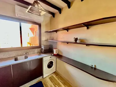 a kitchen with a sink and a washing machine at City zen gueliz 1BR apartment in Marrakech