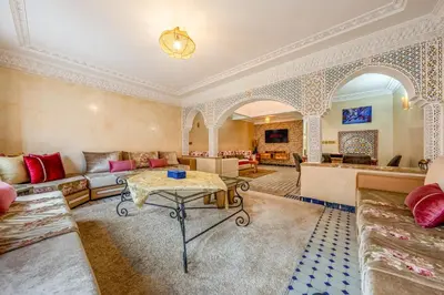 a living room with a couch and a table at Elegant 3-Bedroom Duplex with Pool in Marrakech