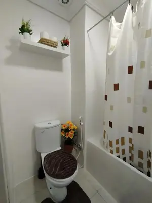 a bathroom with a toilet and a shower at Marrakech Guéliz Piscine & Terrasses Ensoleillées in Marrakech