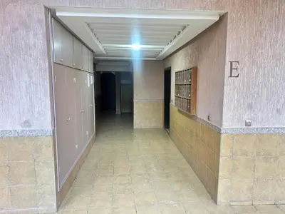 an empty hallway in a building with a hallway at Marrakech Guéliz Piscine & Terrasses Ensoleillées in Marrakech