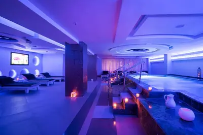 a swimming pool in a large room with a swimming pool at Savoy Le Grand Hotel Marrakech in Marrakech