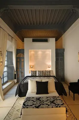 a bedroom with a large bed in a room at Riad Adore in Marrakech
