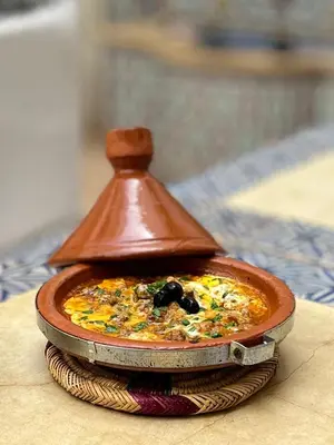 a small dish of food on a plate on a table at Riad des Lys in Marrakech