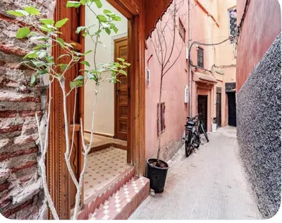 a narrow alley with a bike parked next to a building at Riad Jenan Adam in Marrakech