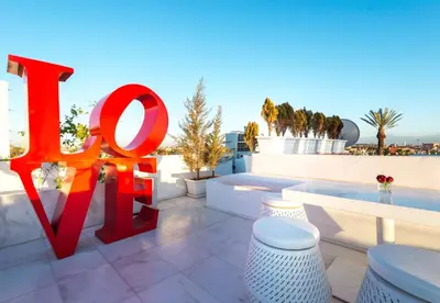 a large red sign on top of a building at Riad Elisa & Spa in Marrakech
