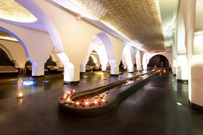 a long hallway with lights in a building at Riad Elisa & Spa in Marrakech