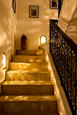 a set of stairs in a house with lights at Riad El Walida in Marrakech
