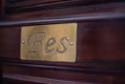 a close up of a brass plate on a wooden drawer at Riad El Walida in Marrakech