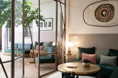 a living room with a couch and a table at Riad Sashema in Marrakech