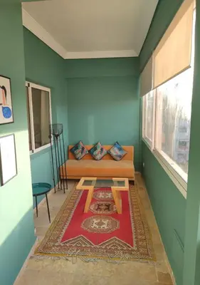 a room with a bed and a table in it at Dar Guéliz in Marrakech