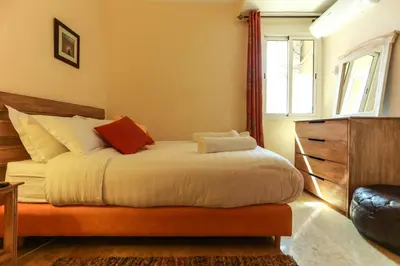 a bedroom with a bed and a window at Dar Guéliz in Marrakech