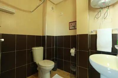 a bathroom with a toilet and a sink at Dar Guéliz in Marrakech