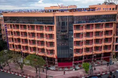 an overhead view of a large orange building at Hôtel Les Ambassadeurs in Marrakech