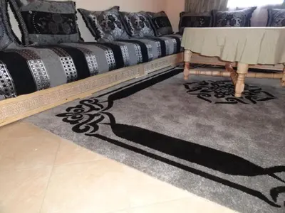 a shadow of a woman on a rug in a living room at Apartment Twins 12 in Marrakech