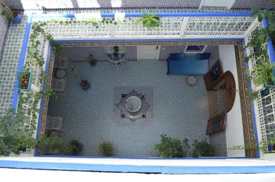 a model of a house with a tile wall at Riad Hôtel Essaouira in Marrakech
