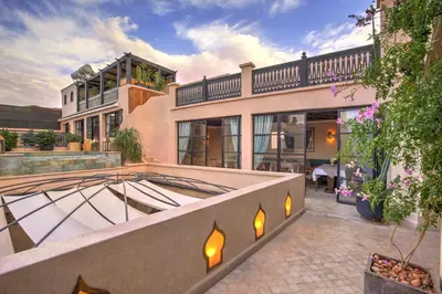 an exterior view of a house with a balcony at Riad Bijoux Marrakech in Marrakech
