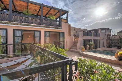 an exterior view of a house with a balcony at Riad Bijoux Marrakech in Marrakech