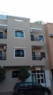a black car parked in front of a building at Studio meublé proche du centre ville in Marrakech