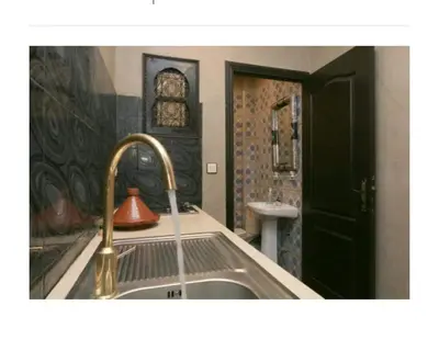 a kitchen with a sink and a faucet at Studio meublé proche du centre ville in Marrakech