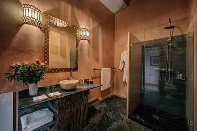 a bathroom with a sink and a shower at Riad Siwan in Marrakech