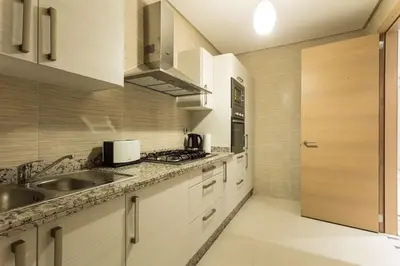 a kitchen with a sink and a counter top at Prestigia 16 in Marrakech