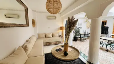 a living room with a couch and a table at Riad Sarah Sabrina in Marrakech