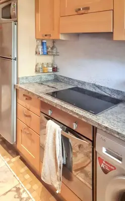 a kitchen with a sink and a stove top oven at Comfortable Apartment in Marrakech with Shared Pool, 124 sqm in Marrakech
