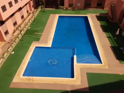 an overhead view of a swimming pool in a building at Mouzdalifa Apartment In City Center in Marrakech
