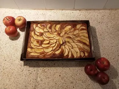 a cake sitting on top of a counter with apples at Dar al Sultan in Marrakech