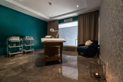 a hospital room with a table and a chair at Wazo Appart-Hôtel in Marrakech