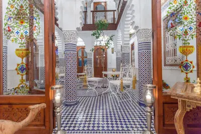 a room with blue and white tiles on the floor at Astra Damus Hotel in Marrakech
