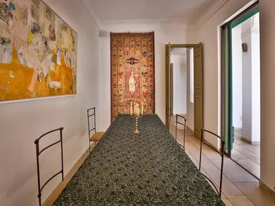 a room with a tapestry hanging on the wall at Riad Oasis 3 in Marrakech