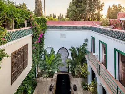 an aerial view of a white building with plants at Riad Oasis 3 in Marrakech