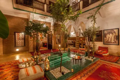 a living room with a pool in the middle of the room at Riad Dar Yema in Marrakech
