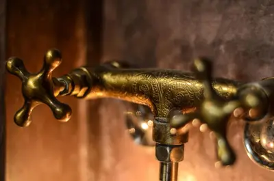 a close up of a brass water faucet at Riad Ayni in Marrakech