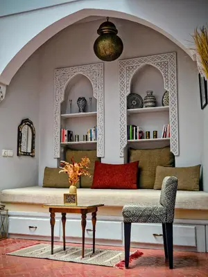 a living room with a couch and a table at Riad Laly Tourisme Eclairé Le bijou de la medina in Marrakech