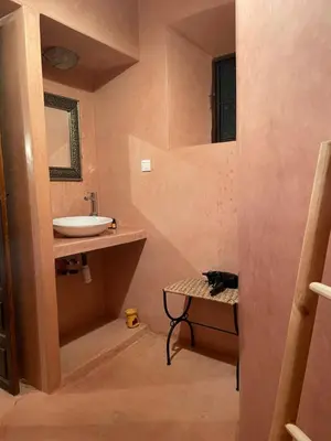 a small bathroom with a sink and a sink at Riad Safia in Marrakech