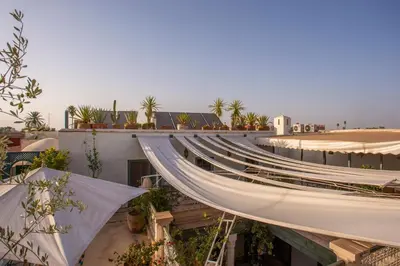 arial view of a building with trees on the roof at Riad Azahar in Marrakech