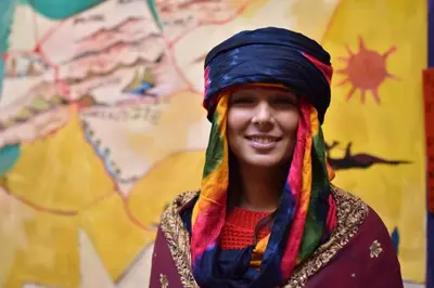 a young man wearing a scarf on his head at Kasbah Red Castel Hostel in Marrakech