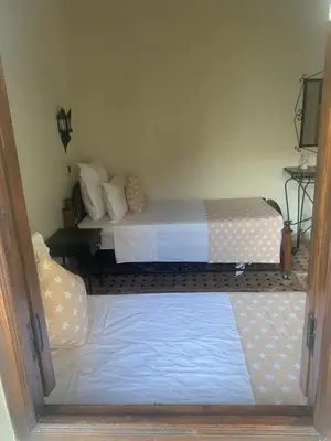 a bedroom with two beds in a room at Riad Tidar by Phoenix in Marrakech