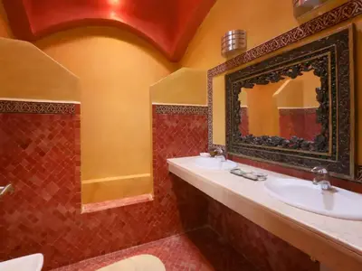 a bathroom with a sink and a mirror at Maison d'hote Oceania in Marrakech
