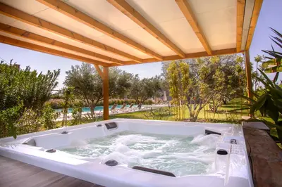 a jacuzzi tub on the patio of a house at Villa Jardins D'Isa in Marrakech