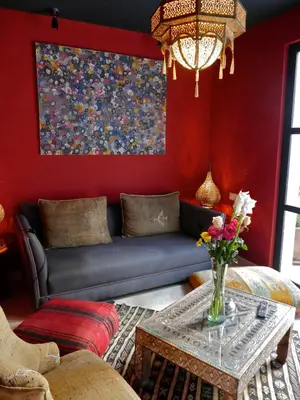 a living room with a couch and a table at Riad Zebrakaro in Marrakech
