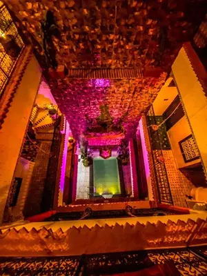 an overhead view of a building with purple lights at Riad Salma Restaurant Spa in Marrakech