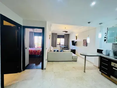 a living room with a couch and a table at Sabor Apartments Anas Majorelle in Marrakech
