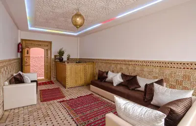 a living room with a couch and a table at Hostel Amour d'auberge in Marrakech