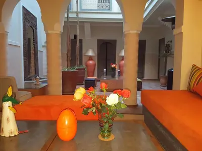 a room with a vase of flowers on a table at Dar Andamaure in Marrakech