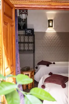 two beds in a room with two beds sidx sidx sidx at Riad Zayane Atlas in Marrakech