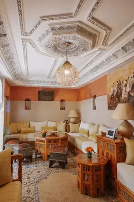 a living room with a couch and a coffered ceiling at Riad Zayane Atlas in Marrakech