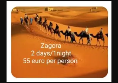 a group of people riding horses in the desert at Riad Tifor in Marrakech